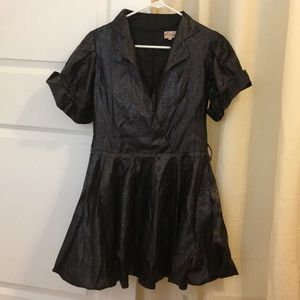 A black dinner dress or gown